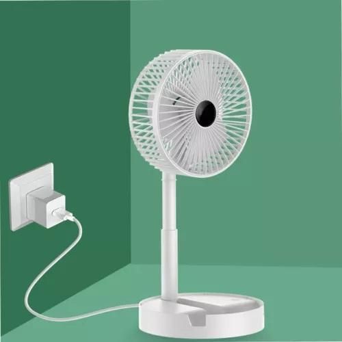 Portable USB white desk fan plugged in, showcased on green background at NayiDeals