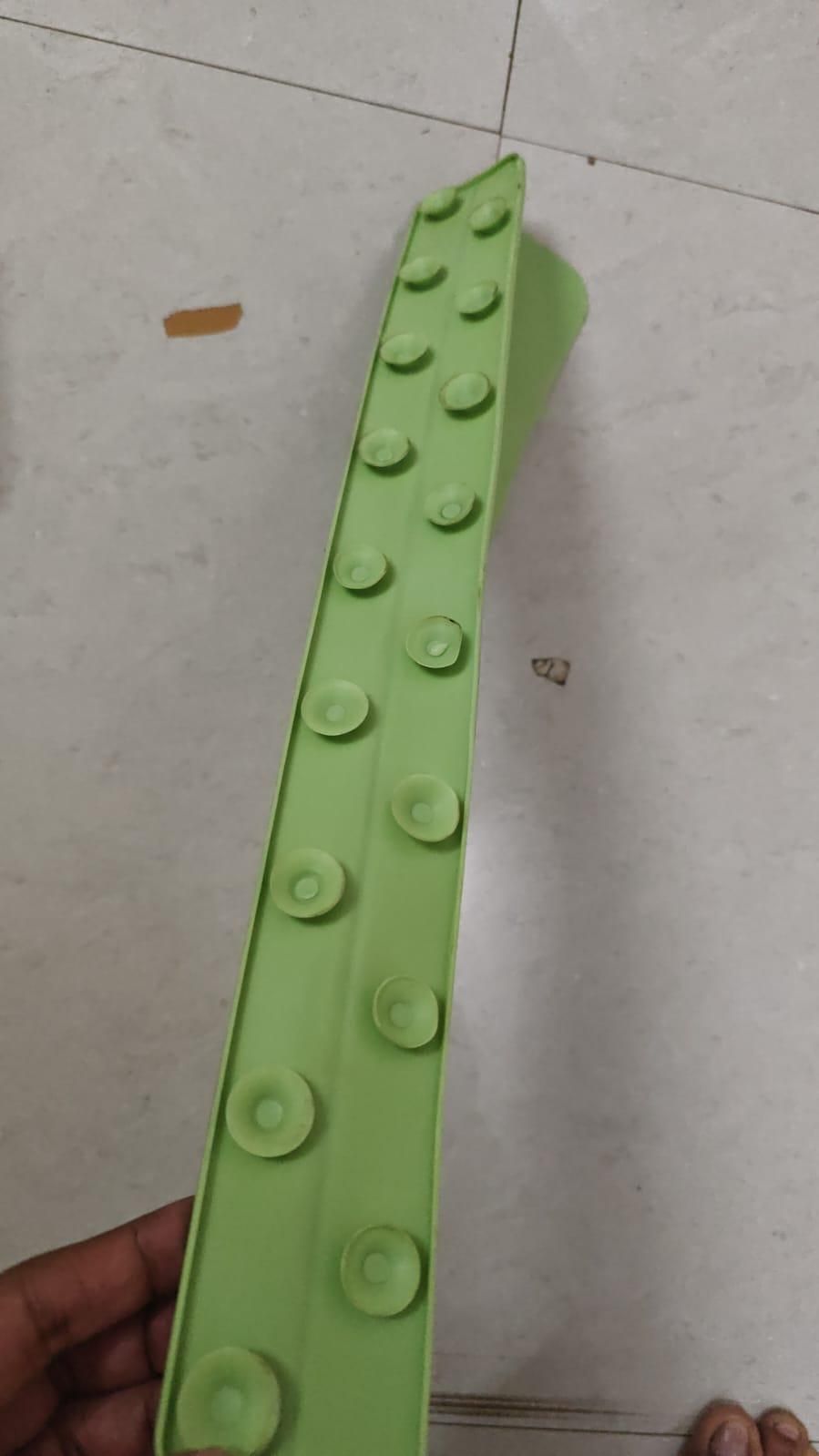 Green silicone strip with suction cups, trending home gadget at NayiDeals India